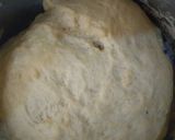 A picture of step 2 of Fateerah with chicken sauce.