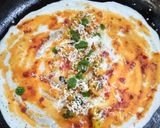 A picture of step 4 of Shezwan masala cheese Dosa roll.