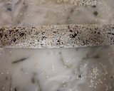 A picture of step 7 of Til and peanuts date roll.