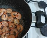A picture of step 1 of Tom yum shrimp rice.
