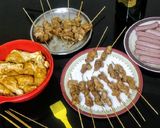 A picture of step 7 of Chicken paprika drums Skewered red hot Shrimps and grilled sausages.