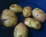 A picture of step 1 of Spiced potato wedges#Festive dish contest Nairobi West.