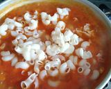 A picture of step 6 of Cheesy red sauce pasta.