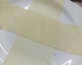 A picture of step 1 of Macroni springrolls or box patties.