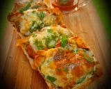 A picture of step 7 of Cheesy masala pav toasty Open pav sandwich.