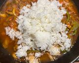 A picture of step 5 of One Pot Steamed White Fish and Savory Rice with Roasted Garlic and Tomato Sauce.