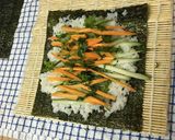 A picture of step 6 of Sushi vegetable roll.