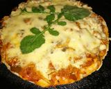 A picture of step 4 of Stove Top Chicken Tikka Pizza.