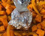 A picture of step 6 of Roasted Sweet Potatoes with Spices, Yellow Peppers, and Oven-Roasted Garlic.