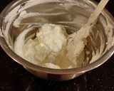 A picture of step 13 of Fresh Strawberry Chip Cake with Lemon Cream Frosting.