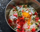 A picture of step 4 of Besan onion tomato chilla.