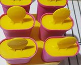 A picture of step 5 of Berry Creamy Popsicles.