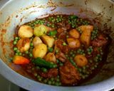 A picture of step 12 of Karahi style alu matr chicken ka salen.