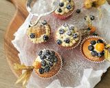 A picture of step 6 of Blueberries and vanilla frosted cup cakes.