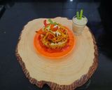A picture of step 6 of Schezwan noodles in noodles basket with kiwi banana smoothie.
