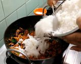 A picture of step 5 of Kaisasive chitranna / coconut mustard rice.