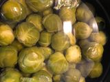 Coles de Bruselas salteadas con jamón y puré de patata
