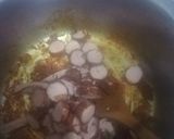 A picture of step 3 of Tumeric rice with sausages, egg curry and salad.
