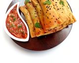 A picture of step 16 of Crunchy chicken filo cigars.