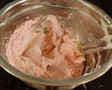 A picture of step 11 of Dark Chocolate Layer Cake with Fresh Strawberry Cream Frosting and Filling.