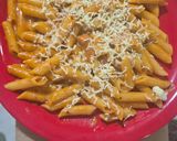 A picture of step 10 of Red sauce cheesy pasta.