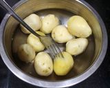 A picture of step 1 of Kashmiri Dum Aloo.