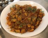 Une image de l'étape 11 de Pommes de terre sautées aux tomates, ail et épices.