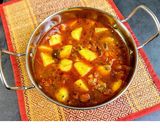 A picture of step 7 of Potato and tomato curry.