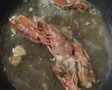 Foto del paso 2 de la receta: Lubina con gambas y almejas en salsa
