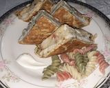 A picture of step 4 of Eggs wrapped Pasta Sandwich.
