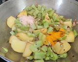 A picture of step 5 of Sem Aloo with Kalonji Seeds.