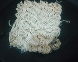 A picture of step 2 of Aisha's Special stir fry noodles with minced meat and sunny side up egg.