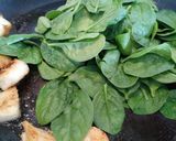 A picture of step 2 of Pan fried scallops with wilted spinach.