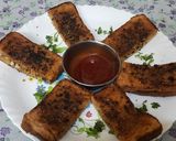 A picture of step 6 of Garlic Brown Bread with peri peri masala Dominos style sticks.