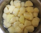 A picture of step 1 of Achari dum aloo.