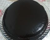 A picture of step 8 of Choco cake with Chocolate ganache topped with Chocolate scrapes.
