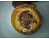 A picture of step 4 of Orange Kulfi in orange shell.