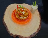 A picture of step 6 of Schezwan noodles in noodles basket with kiwi banana smoothie.