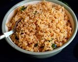 A picture of step 5 of Ellu satham (ellorai in Tamil)-Rice cooked with sesame seed masala powder.