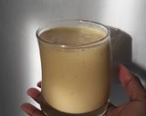 A picture of step 2 of Pineapple and mango smoothie, with ice cream.