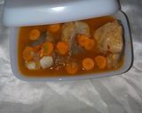 A picture of step 3 of Fish pepper soup garnished with carrot.