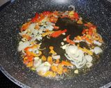 Foto del paso 2 de la receta: Arroz rojo con garbanzos y chorizo