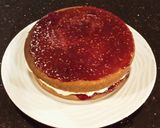 A picture of step 18 of Vanilla Lemon Raspberry Layer Cake with Whipped Cream Buttercream Frosting.