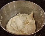 A picture of step 15 of White Layer Cake with a Raspberry Swirl Cheesecake center layer and a Raspberry Cream Frosting.