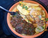 A picture of step 10 of Beef stew served with 🥔 wedges.