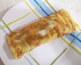 Foto del paso 4 de la receta: Omelette enrollado con queso y hot dog
