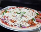 A picture of step 6 of Simple Chicken Tikka Pizza.