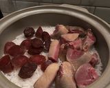 A picture of step 8 of Rice with Aged duck legs and Chinese sausages.