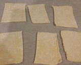 A picture of step 6 of Raspberry White Chocolate Pastry Strudels.