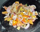 A picture of step 2 of Mushroom Masala in red gravy.